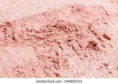 The texture of pink sand on the beach in the afternoon