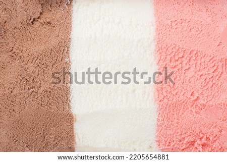 texture of pink, white and chocolate ice cream like background, close up