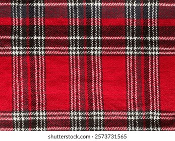 Texture of plaid seamless pattern for your design in red, white and navy blue, checked pattern. Red and black wool plaid print as background. Symmetric square pattern. Scottish tartan pattern.