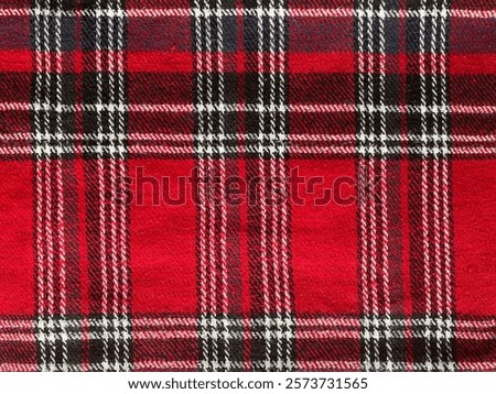 Texture of plaid seamless pattern for your design in red, white and navy blue, checked pattern. Red and black wool plaid print as background. Symmetric square pattern. Scottish tartan pattern.