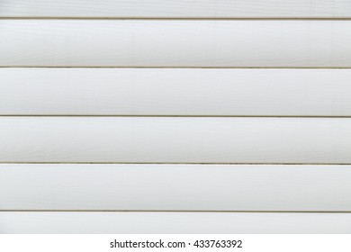 Texture of plastic panels, white siding, house wall