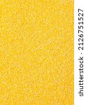 Texture of Polenta or Cornmeal Flour. Ground  Dried Corn or Corn Grits. Top View. Polenta Background