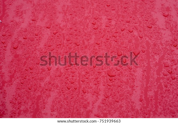 Texture. raindrops on a red\
car\'s hood