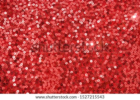 Texture of red pearlescent sequins, macro photo
