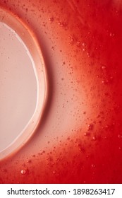 The Texture Of The Red Transparent Cosmetic Gel. Abstract Background