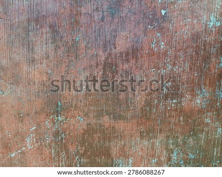 texture of a red wall whose paint has peeled off 