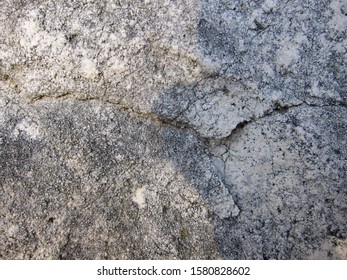 Texture of a rock with cracks