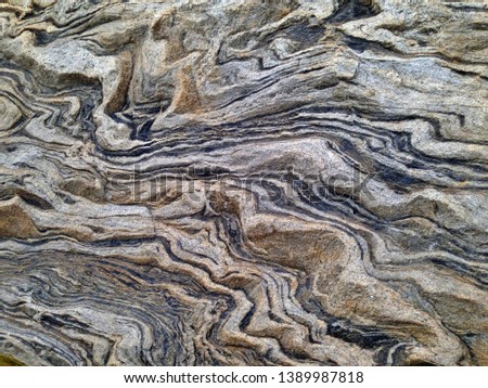 The texture of rock with strange pattern, Abstract surface wallpaper of stone wall