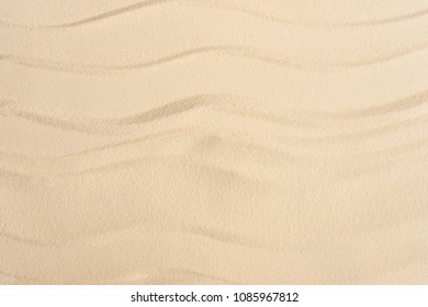 Texture of sandy beach with smooth waves - Shutterstock ID 1085967812
