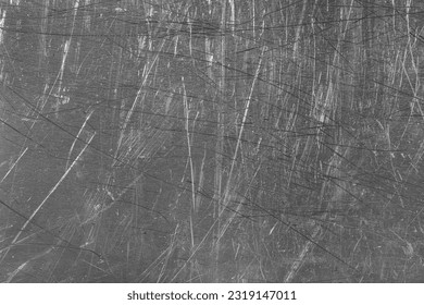 Texture of scratched metallic surface as background, closeup