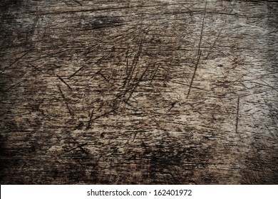 Texture of a severely scarred wood chopping board 