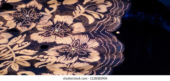 texture silk cloth. dark blue with gold-painted flowers - Powered by Shutterstock