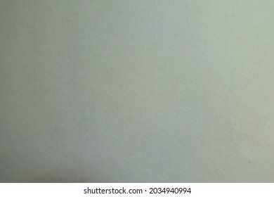 Texture of simple cream white paperboard from above