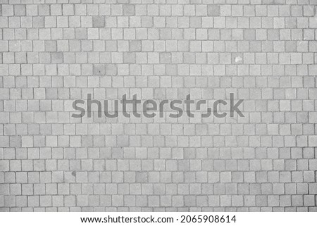 Texture of small cobblestones of a sidewalk or street. Gray cobblestones. Cement squares. Square stone. Texture for matte painting. Foto stock © 