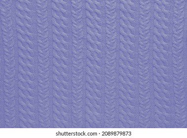 Texture of smooth knitted sweater with pattern. Handmade knitting wool or cotton fabric texture. Background of knitting patterns with a vertical Braid Cable. Color Of The Year 2022 - Very Peri.