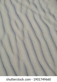 Texture of soft white sand dunes