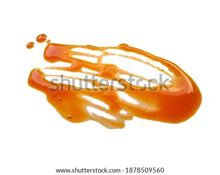 Texture of spilled Chili sauce. Spilled Chili sauce sauce puddle isolated on white background. Chili sauce on white background.