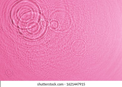 Texture Of Splashing Clean Water On Pink Background