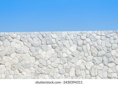 Texture of a stone wall with blue sky,Background of stone wall texture,grunge stone wall background. - Powered by Shutterstock