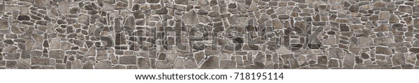 Texture of a stone wall. Old castle\
stone wall texture background. Stone wall as a background or\
texture. Part of a stone wall, for background or\
texture