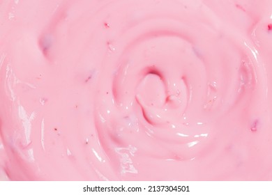 Texture Strawberry Macro Yogurt,Strawberry Frozen Yogurt Background Close Up. Strawberry Ice Cream Texture Close Up. Top View. Pink Fruit Ice Cream Background With Small Pieces Of Berries