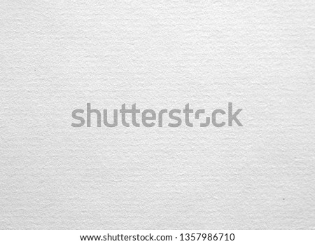 Texture of the surface of the white sheet of ancient laid paper. Laid paper 
is a type of paper having a ribbed texture imparted by the manufacturing process
