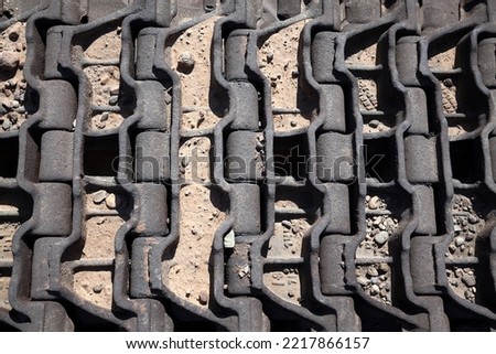 Texture of tank wheel belt. A destroyed tank. Old and Rusty Tank's Wheel Belt. transport and military technology concept.