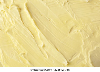 Texture of tasty homemade butter as background, top view - Shutterstock ID 2245924765