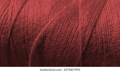 texture of threads in a spool of maroon color on a white background close-up