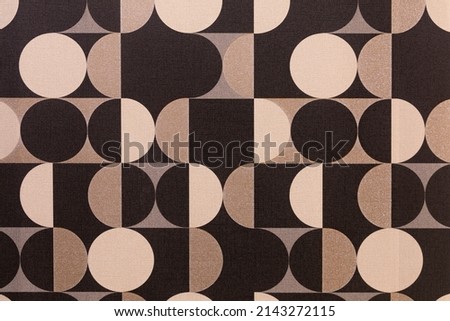 The texture of vinyl wallpaper on a non-woven beige base in the Art Nouveau style. A pattern of colored circles. Beige texture. Abstract circular background.
