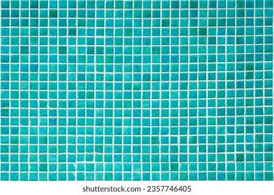 Texture of a wall covered with turqoise decorative brick-like tiles mosaic. Abstract background for design.