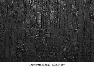 Texture a wall with flowing paint, black background 
