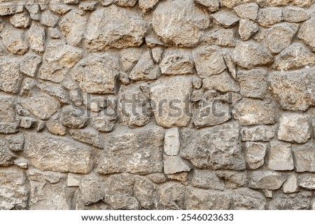 Texture wall stone sandstone with shadows and deep pattern. Clinker tiles or bricks on the wall in the form of wild stone