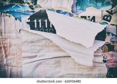 The texture of a wall with torn posters and ads. Bright abstract background ideal for any design                               