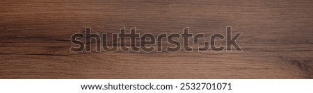 Texture of walnut wood surface, closeup. Banner design