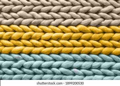 Texture Of Warm Woolen Multicolored Rug, Background. Colors Sail Champagne, Fortuna Gold, Tidewater Green. Pigtail Pattern, Soft Focus.