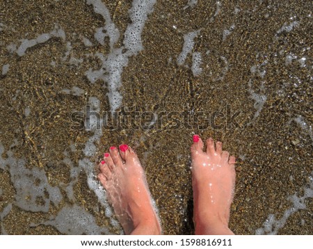 The texture of the water and sea sand. Step into the sea