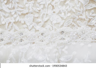 The Texture Of A Wedding Dress, Embroidered With Beads, Rhinestones And Sequins. Close-up, Macro