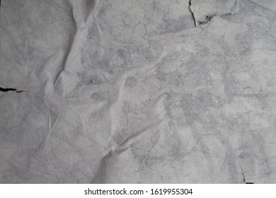 Texture Of Wet White Folded Paper On An Outdoor Poster Wall, Crumpled Paper Background. - Image