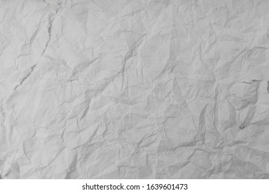 Texture Of Wet White Folded Paper On An Outdoor Poster Wall, Crumpled Paper Background. - Image