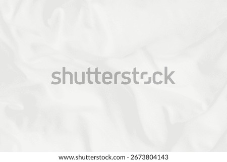 Texture of white blanket and bedding sheet with crumpled or messy in bedroom after wake up.