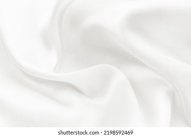 The texture of a white fabric made of silk with folds and wrinkled. Background of light material - Shutterstock ID 2198592469