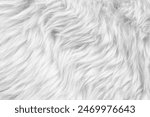 Texture of white faux fur as background, closeup