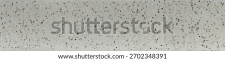 Texture of white glazed ceramic floor showing crackle patterns and black speckles, creating a detailed and realistic decorative surface