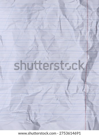 The texture of a white notebook sheet with diagonal lines and numerous creases and wrinkled areas across the entire surface.