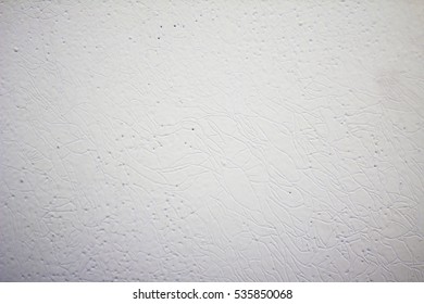 Texture Of White Painted Metal Door With Patterns Of Stripes And Dots