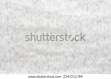 Texture of white porous fabric. Background from napkin texture