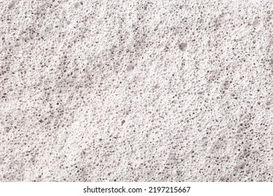 Texture Of White Porous Stone Closeup
