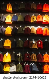 Texture Of Winter Hats On The Store Counter. Woolen Hats On The Market. Colorful Winter Hats