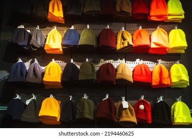 Texture Of Winter Hats On The Store Counter. Woolen Hats On The Market. Colorful Winter Hats